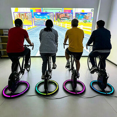 よい価格 3500 ルーメンのゲーム化されたサイクリング投影システムを備えたインタラクティブ エクササイズ バイク。3 つのゲーム モードと超低遅延トラッキングを備えています。 オンライン